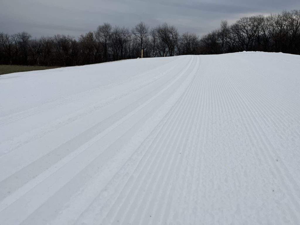 CXC ski trails that have been freshly groomed to show both a classic and freestyle lane